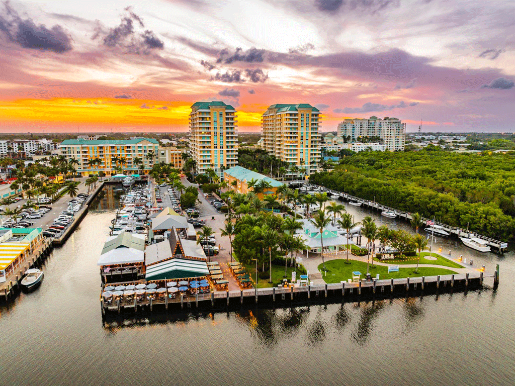 Marina and waterfront condominiums at sunset in Boynton Beach